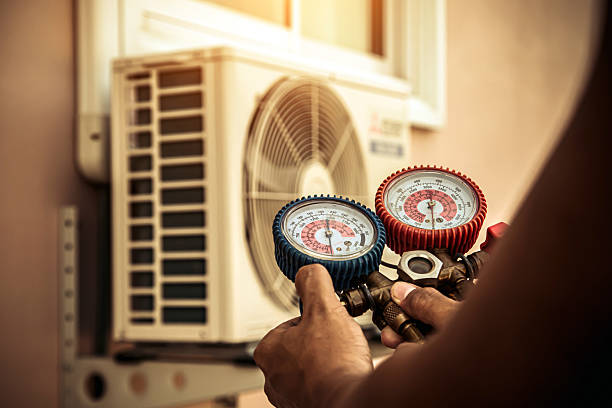 Professional Air Conditioning Service technician working in Center Moriches, NY